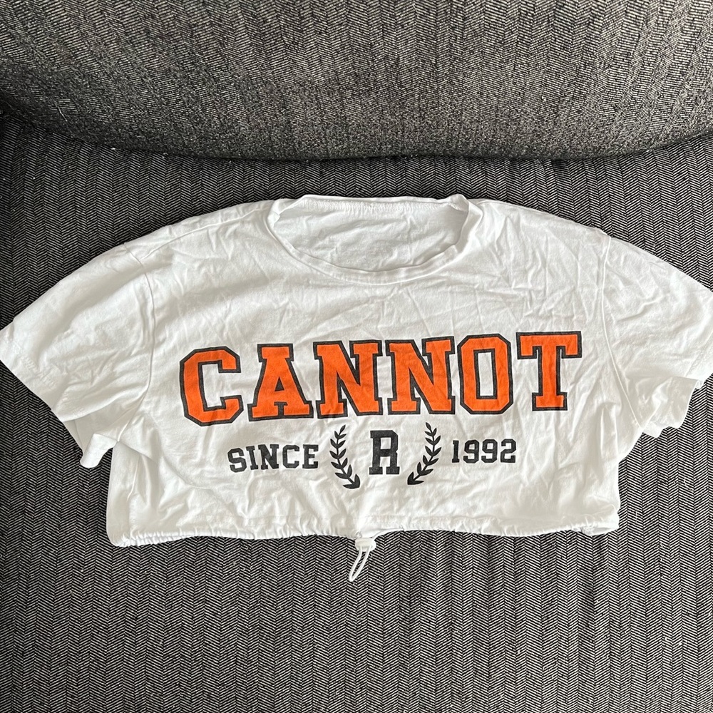 Graphic, white crop. Size medium but fits small.